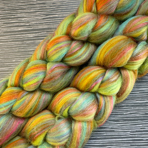 Multicolored yarn skein on a textured surface
