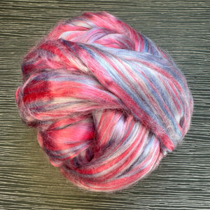 Multicolored ball of fiber on a textured surface